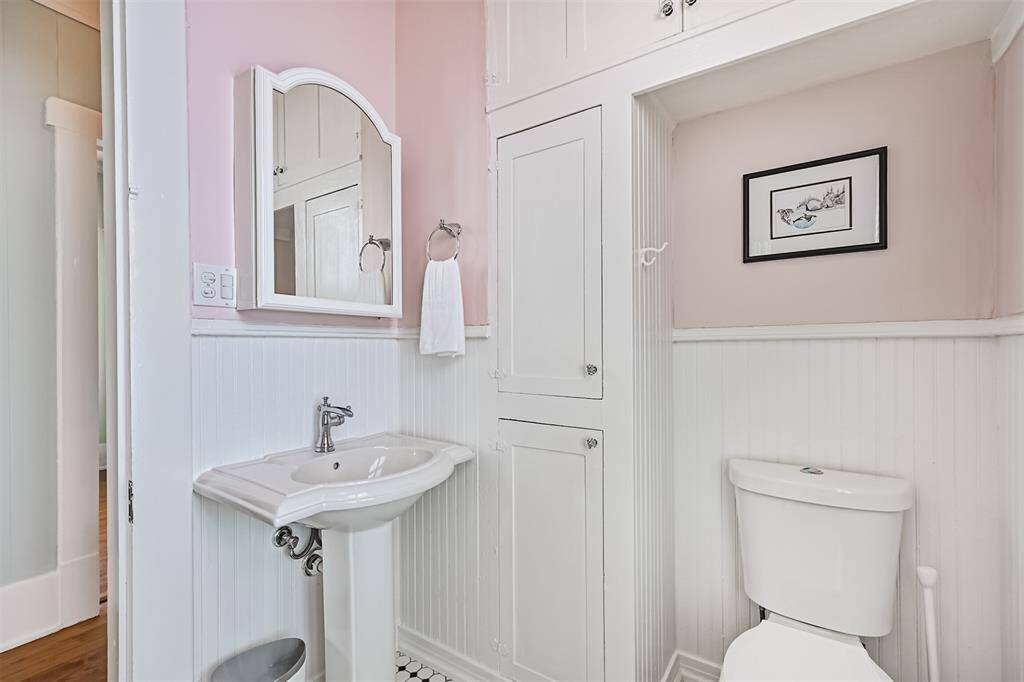 Full Bathroom with custom built-in storage cabinets.