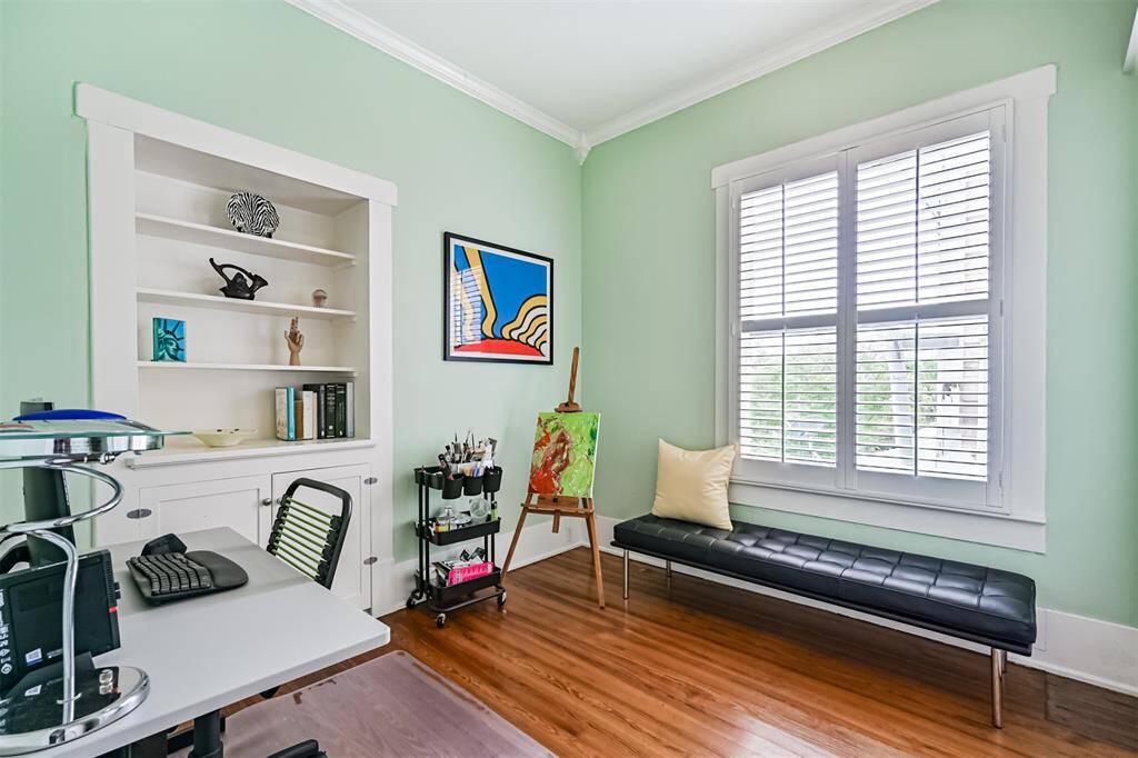 Third Bedroom features original built-ins. This light-filled room could be used as an office or studio space.