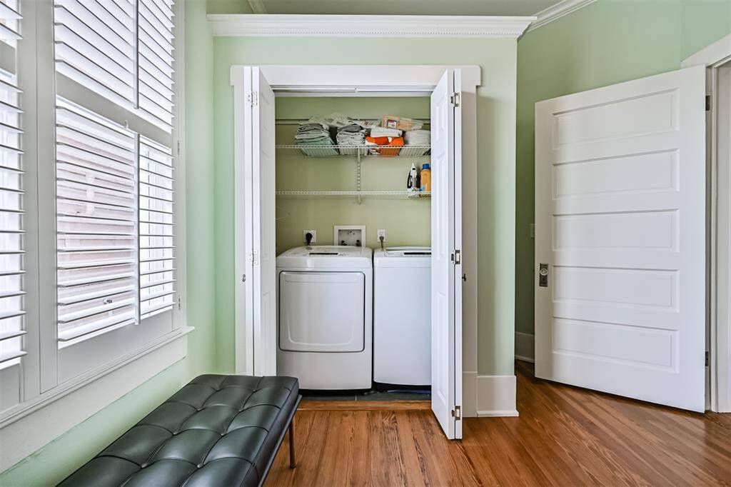 Laundry is currently located in the third bedroom up-stairs. This current location provides ease of use for upstairs bedrooms; however, the units could be easily relocated.