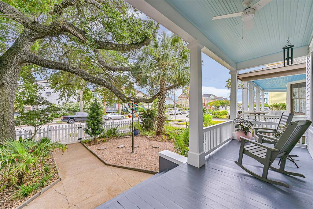 The freshly painted spacious front porch offers plenty of space for rocking chairs.