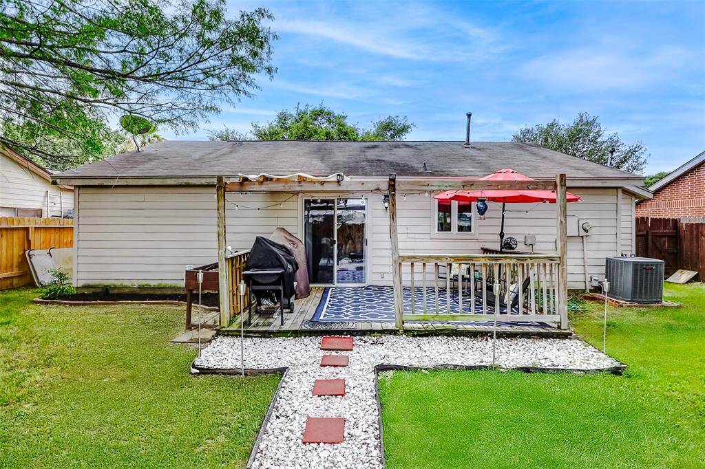 Covered patio area with sliding doors that open up into dining area.