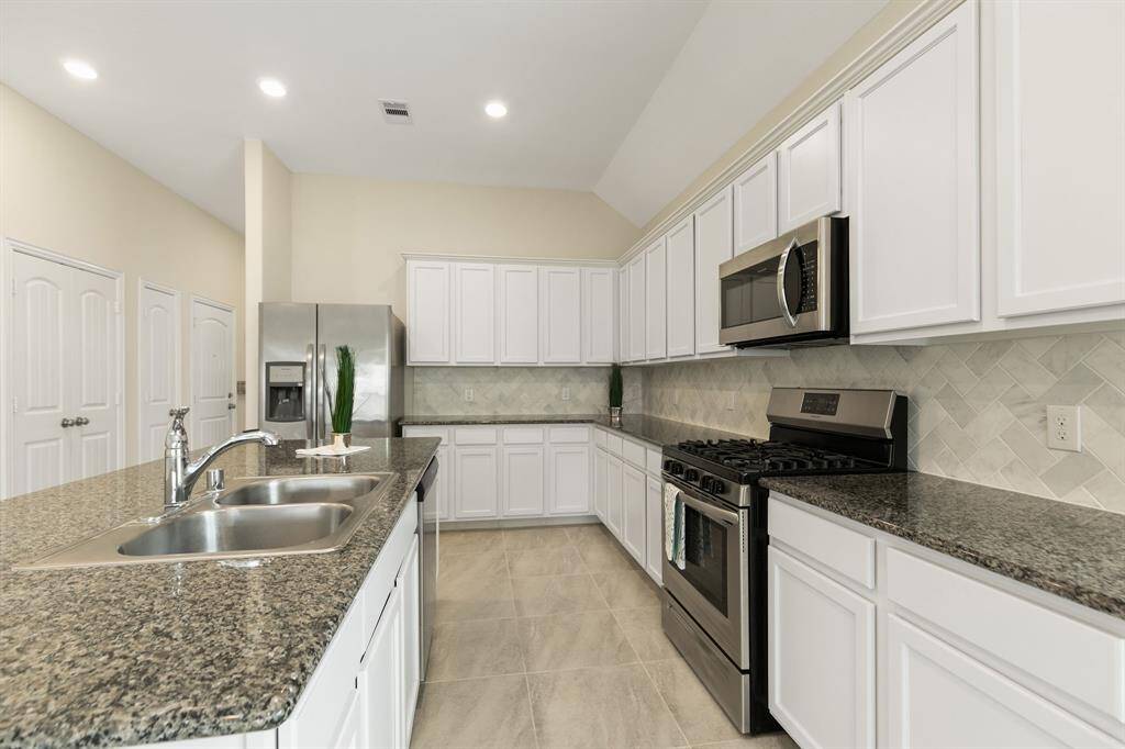 Modern stainless steel appliances. Fridge included