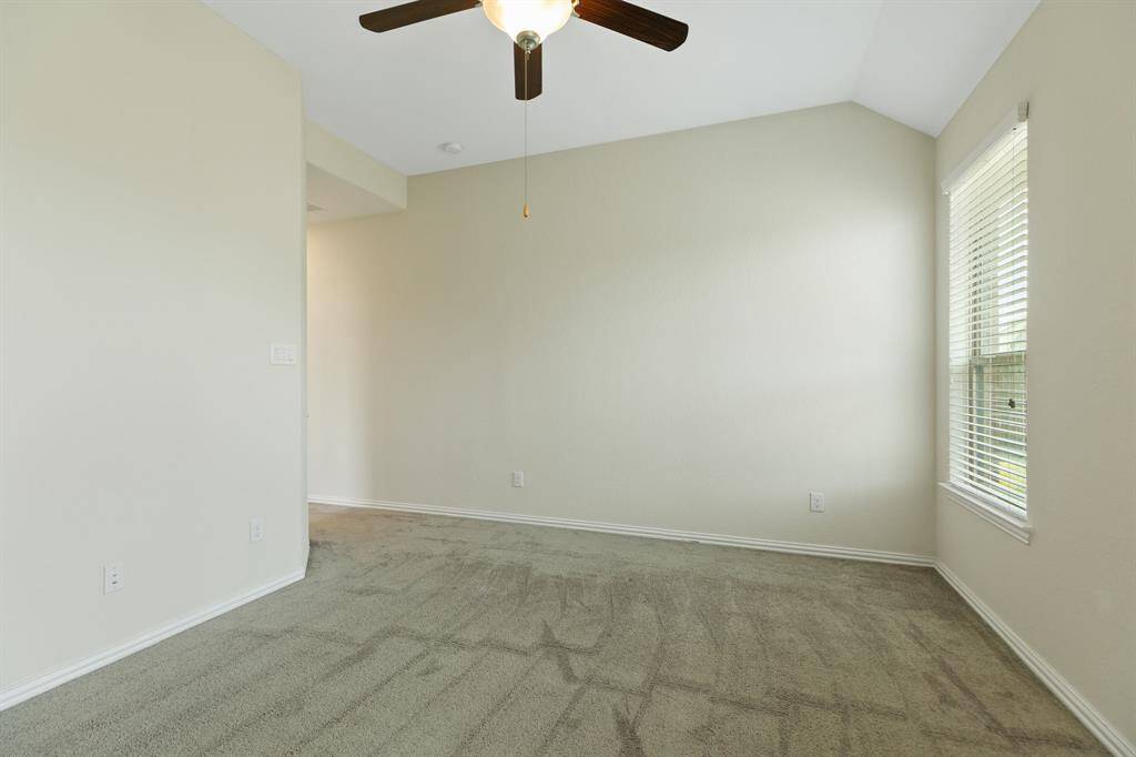 Primary bedroom with ceiling fan