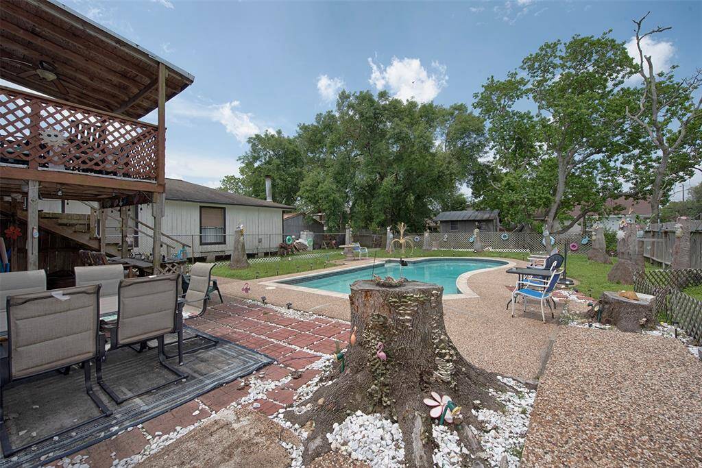 A view of the yard as you approach the backyard.