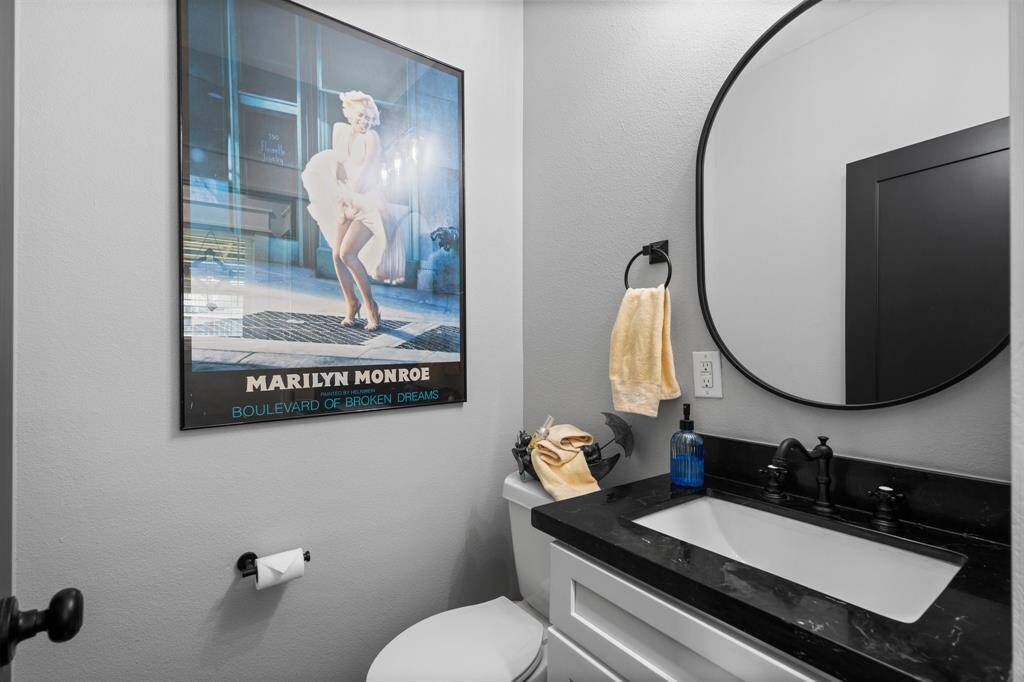Half bath located by breakfast nook and laundry room.