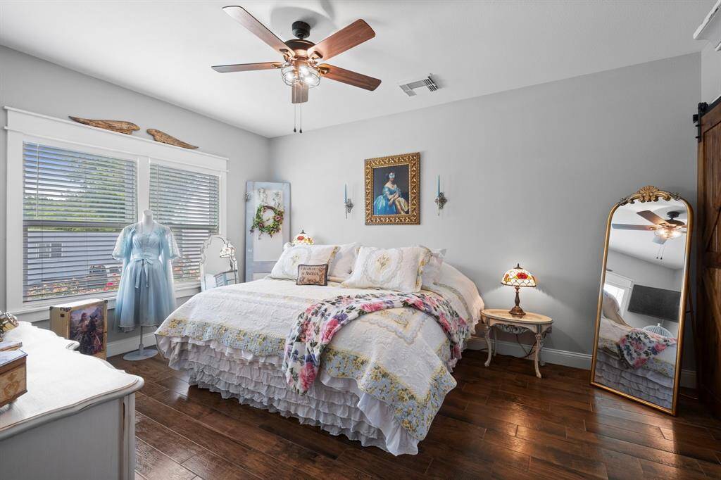 Beautiful primary suite with large windows and plenty of space for a king bed! As you can see, this home has continuous flooring throughout!