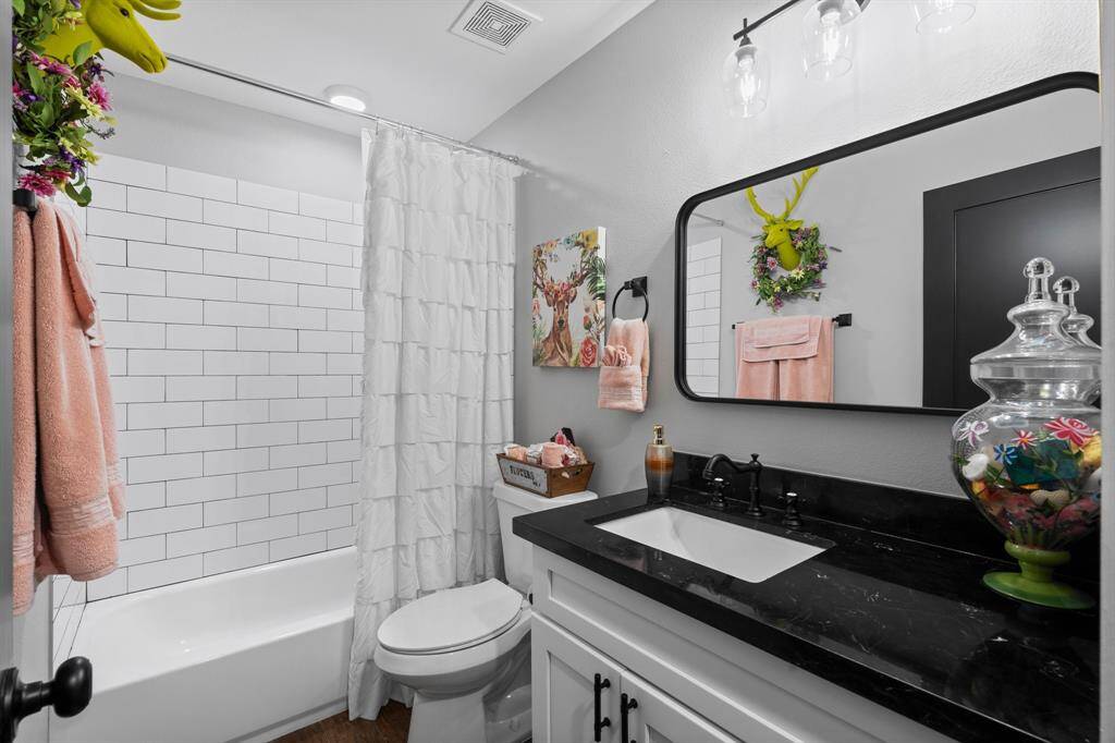 This full bathroom located upstairs is clean and crisp!