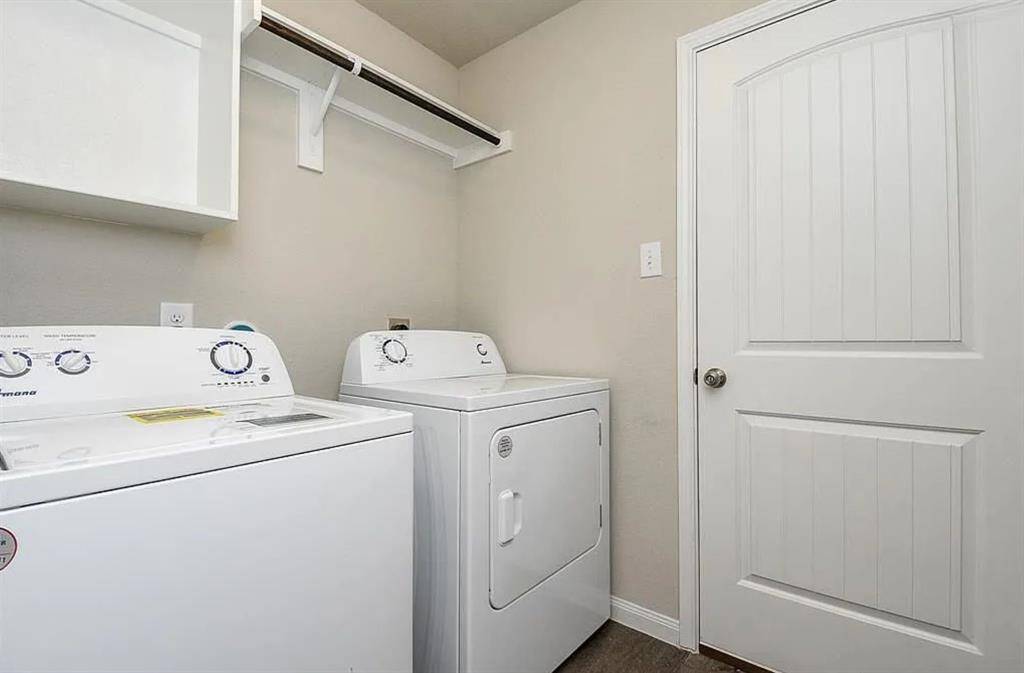 Laundry Room with door leading to the garage.