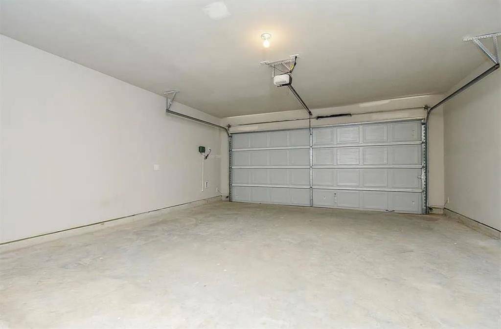 Spacious two-car garage with easy access, perfect for your vehicles and more!