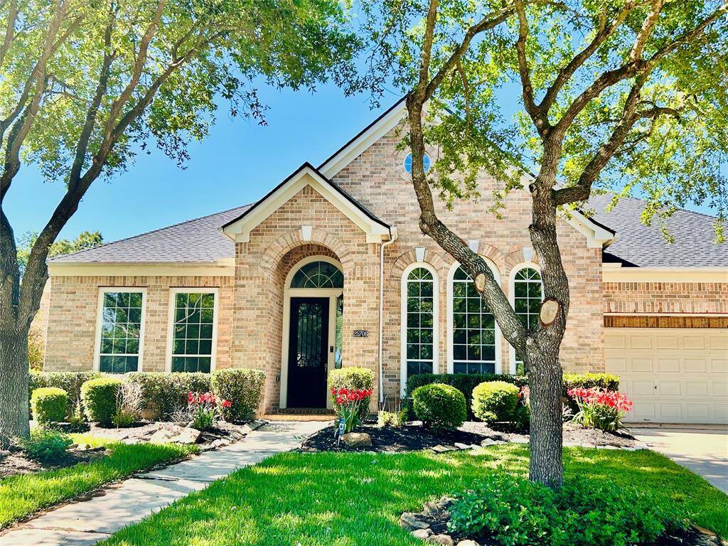 Beautiful elevation all brick Arched entry Welcomes you to your new home
