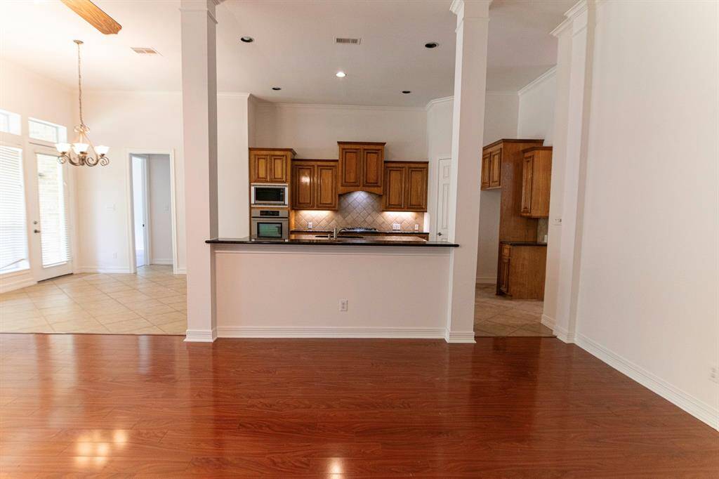 Family room,  with laminate floors! open to kitchen/ breakfast area.
