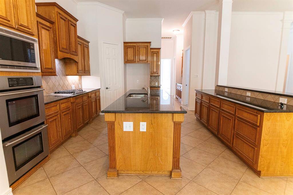Lots of cabinets and drawers to hold so much in this Gormet kitchen.