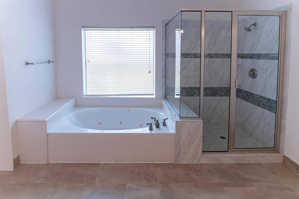 Jetted tub and seperate shower.