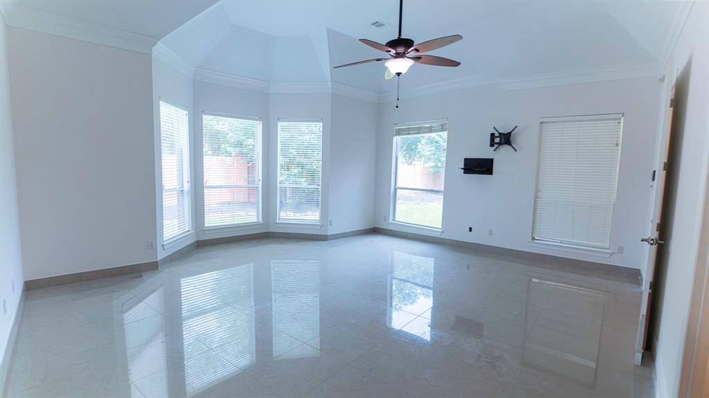 Primary Bedroom with beautiful baywindow, comes with tile flooring and wall mounts brackets ready to install your TV.