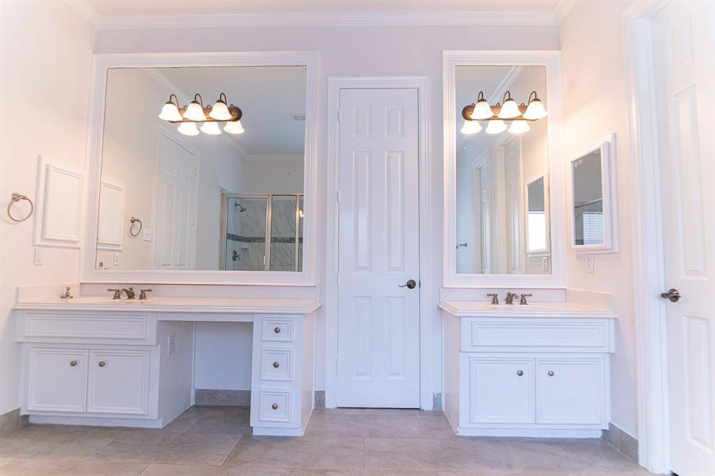Primary bath with dual vanities.