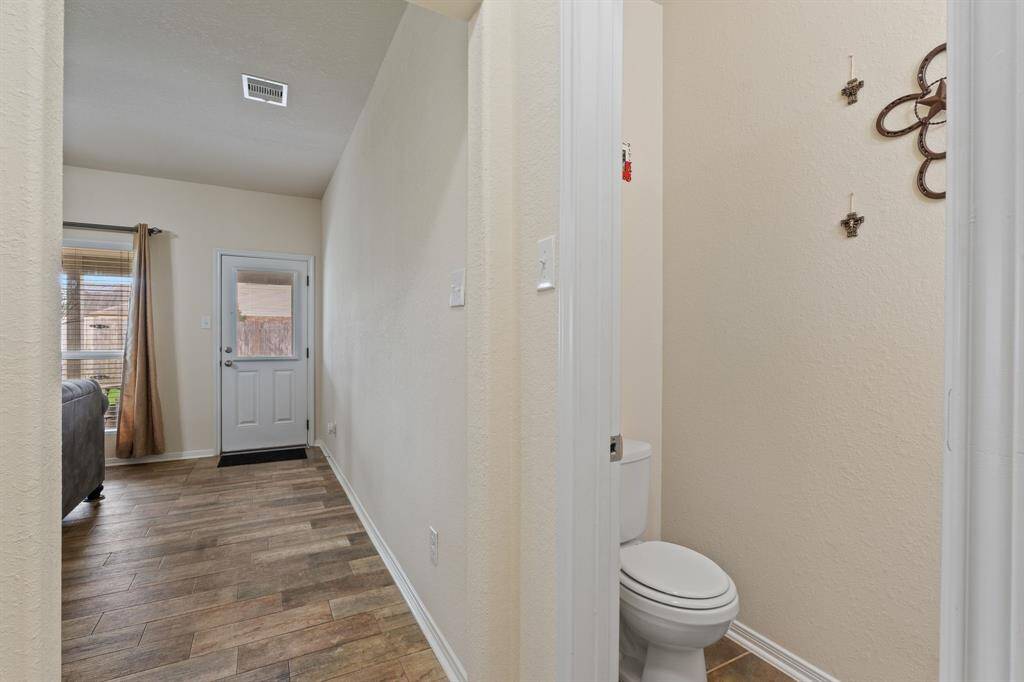On your way to the primary is a half bathroom for guests.