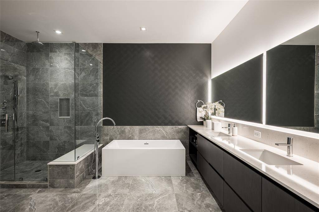 Exquisite primary bathroom that beautifully complements the expansive primary bedroom.