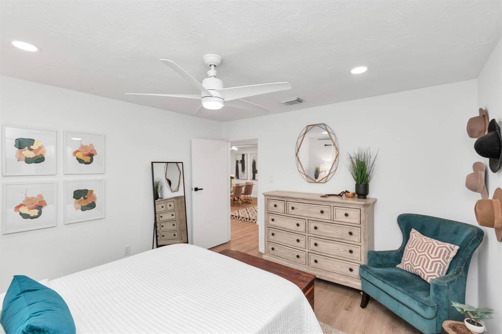 This primary bedroom is the perfect escape with a beautiful ensuite bathroom that includes a walk-in shower and a stylish vanity area. The modern touches and thoughtful layout make it a serene space to relax and recharge.