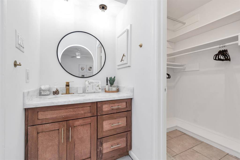 Primary BathrooThe primary bedroom suite includes a stylish walk-in shower and a beautiful vanity area, offering a spa-like retreat right at home. It’s the ideal space to rejuvenate and start your day off in style