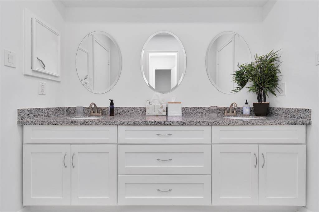 The Jack and Jill bathroom connects two bedrooms and includes a dual-sink vanity, perfect for busy mornings. The tub-shower combo offers versatility, and the thoughtful design ensures both convenience and comfort for those sharing the space.