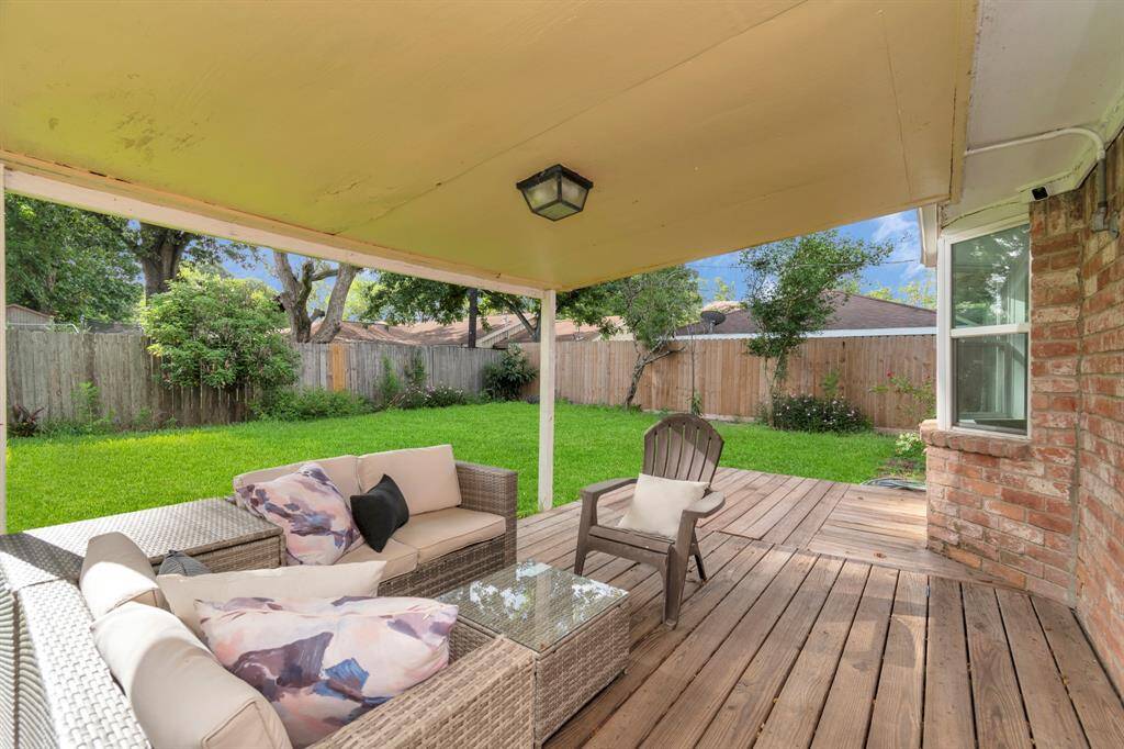 The backyard offers the ultimate outdoor retreat with a covered patio that provides shade and comfort all year round. Relax in the seating area, ideal for dining or unwinding after a long day in the privacy of your own space.
