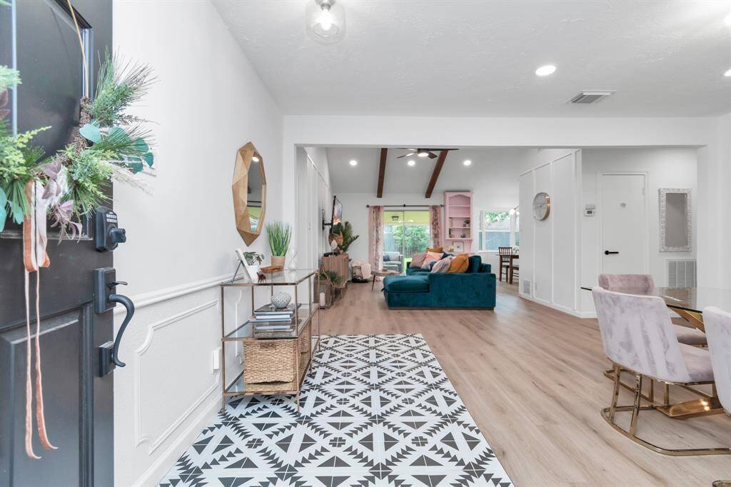Step inside this beautifully updated home featuring wide-plank white oak floors, vaulted ceilings, and an open, airy layout.