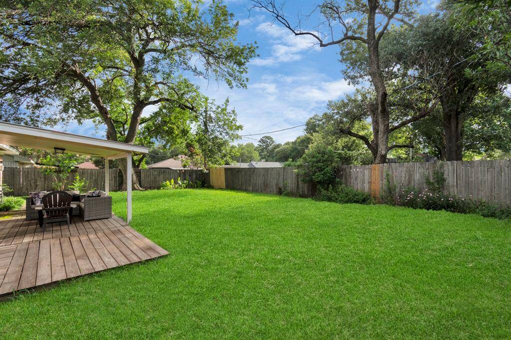 Step outside into the big, fully fenced backyard—ideal for pets, kids, and weekend gatherings. With a private patio and a new fence installed in 2024, this outdoor space is perfect for relaxation and entertaining in a peaceful setting.