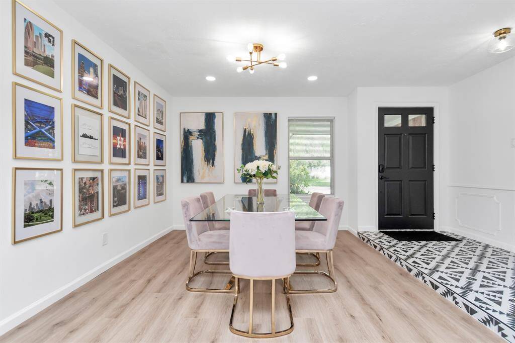 The dining area is seamlessly connected to the kitchen and living room, creating a bright and airy open-concept space that’s perfect for entertaining or family meals. Enjoy natural light pouring in from large windows while dining in style.