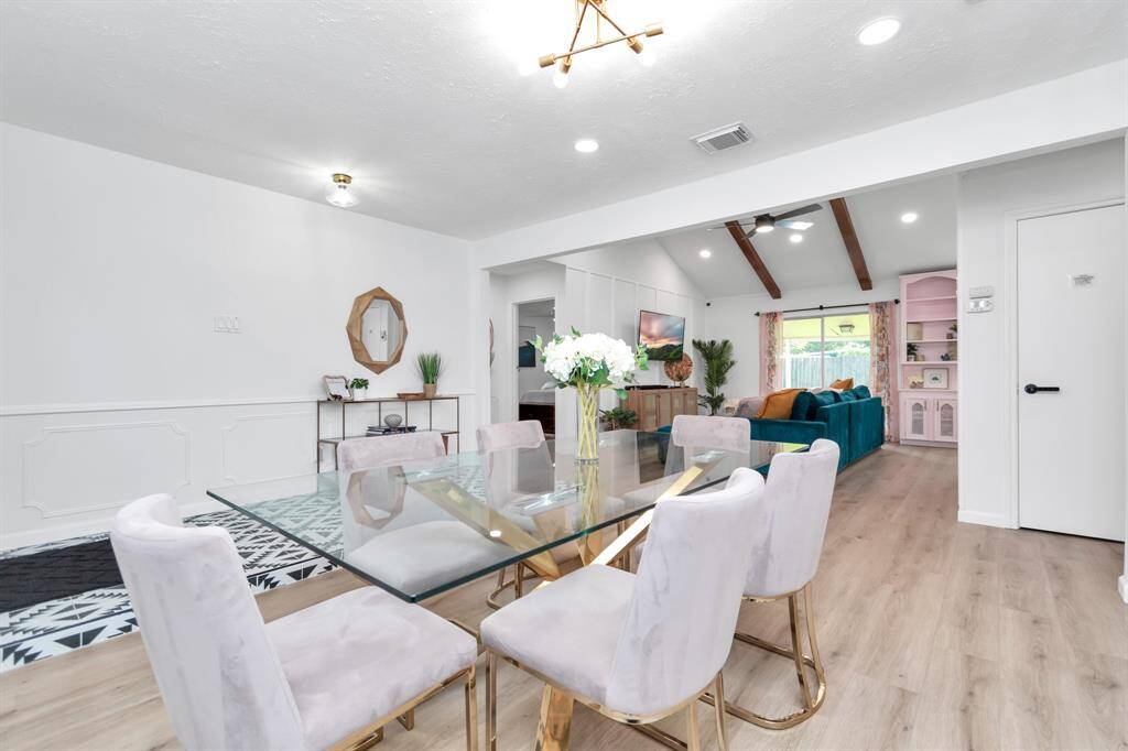 Enjoy meals in the elegant dining area, which is perfectly positioned between the kitchen and living room. This open-concept design allows for easy conversations and a connected atmosphere, making this space ideal for both casual dining and special occasions.
