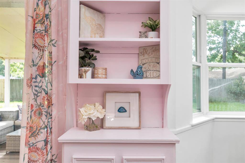 This kitchen features stunning accent-painted cabinetry, adding a pop of color and personality to the space.