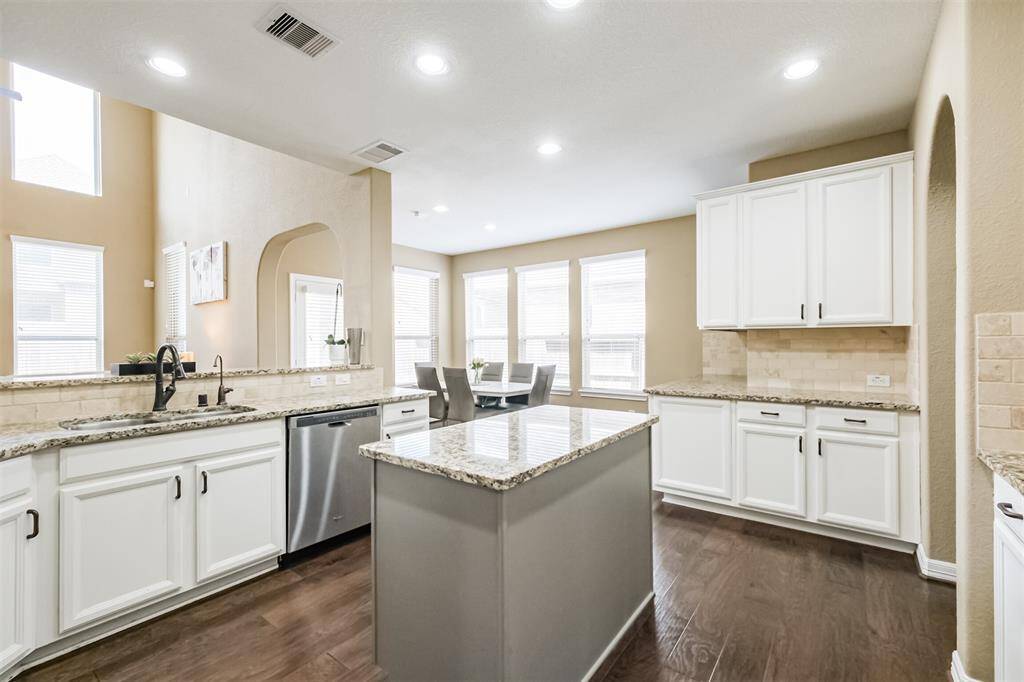 An abundance of cabinets, in addition to the walk-in pantry