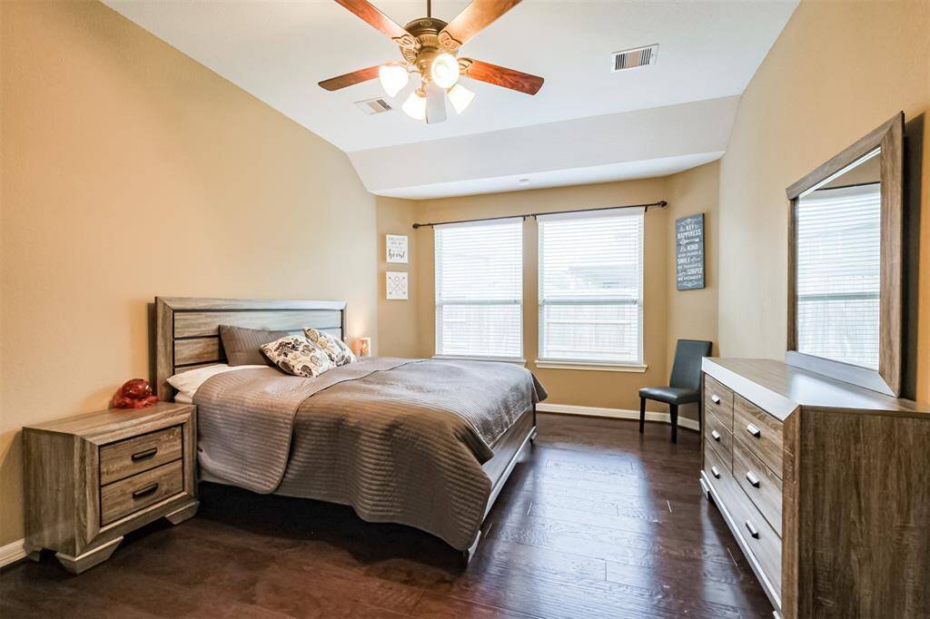 Primary bedroom on the first floor with window alcove