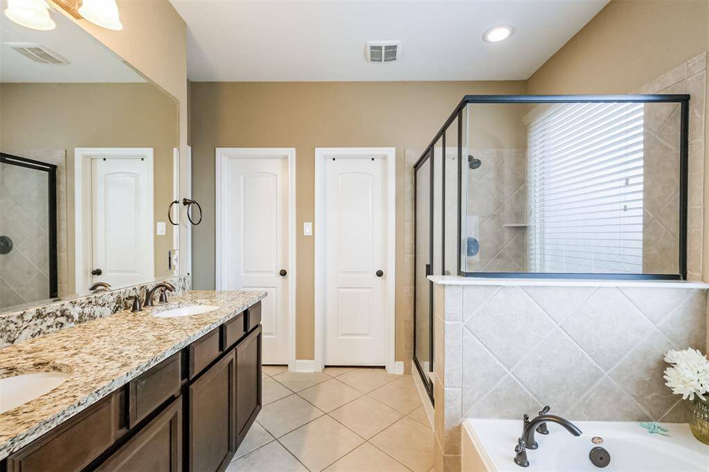 Double sinks, garden tub and separate shower