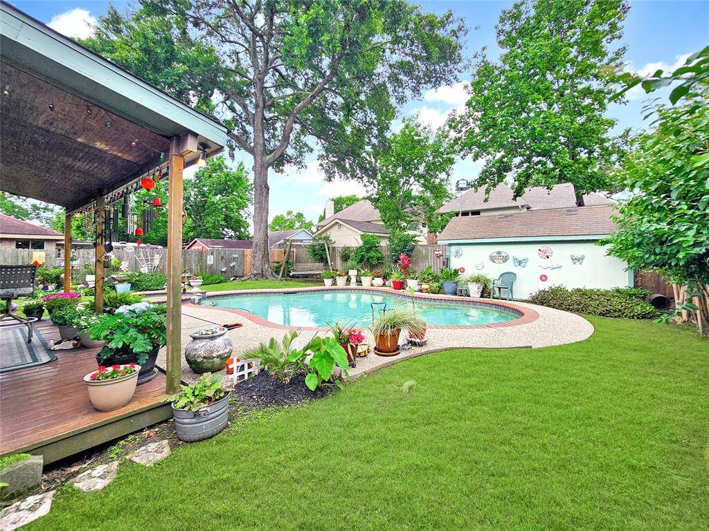 Plenty of grass area to play!  Storage shed will stay.