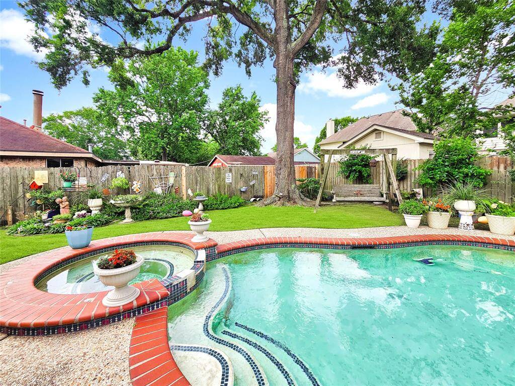 Lots of mature landscaping surrounds the pool area.