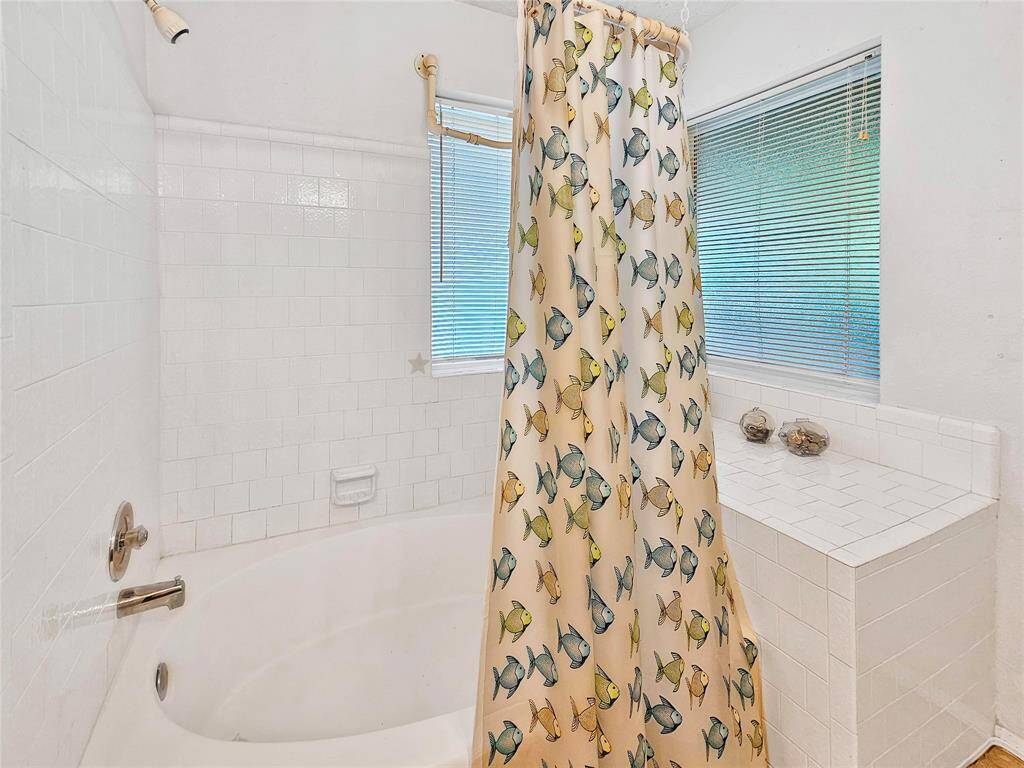 Large soaking tub with shower.