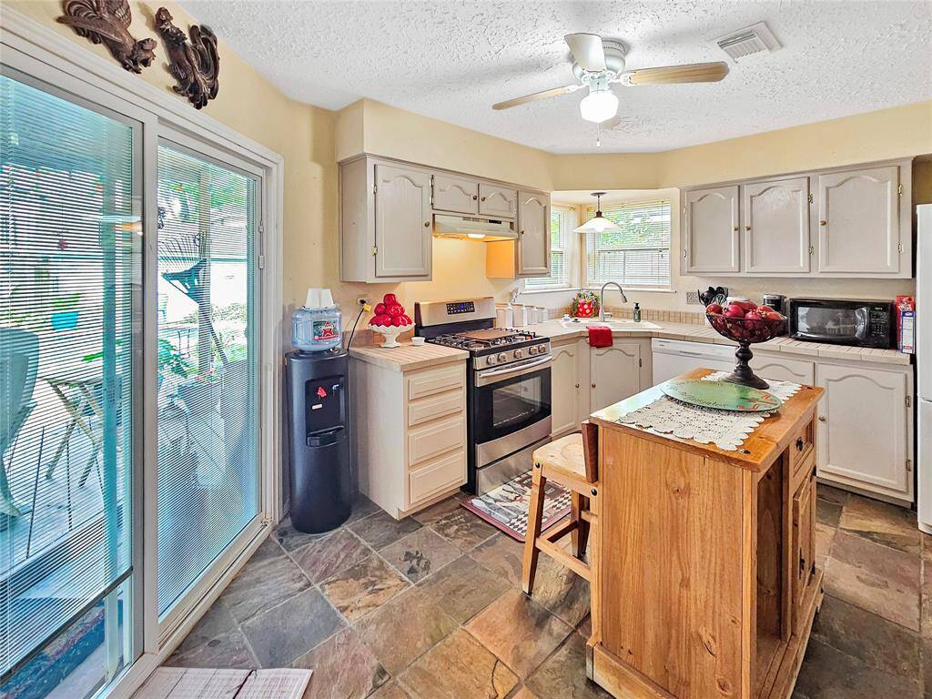 Kitchen has a gas stove, wall pantry, and the fridge will stay.