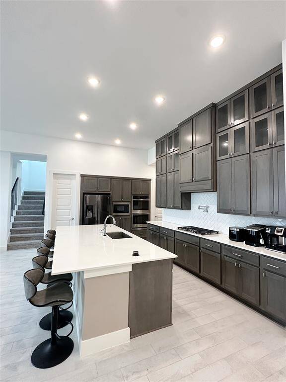Chef's kitchen with oversized island perfect for gathering and prepping.