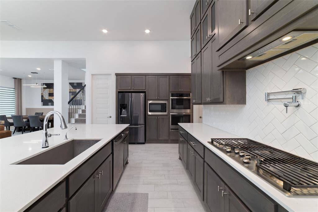 Sleek stainless steel appliances and modern finishes.