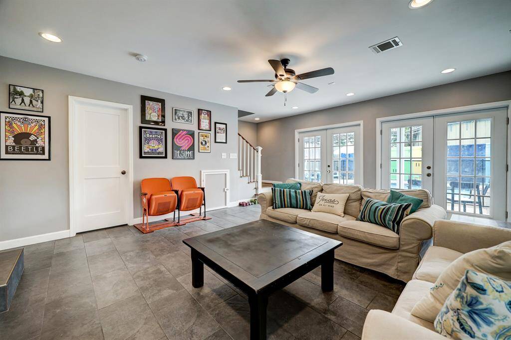 Another view of the fantastic den with plenty of space, a half bathroom and windows that look out to the pool in the backyard. *Photos are from a previous listing and may not reflect the property's current condition.