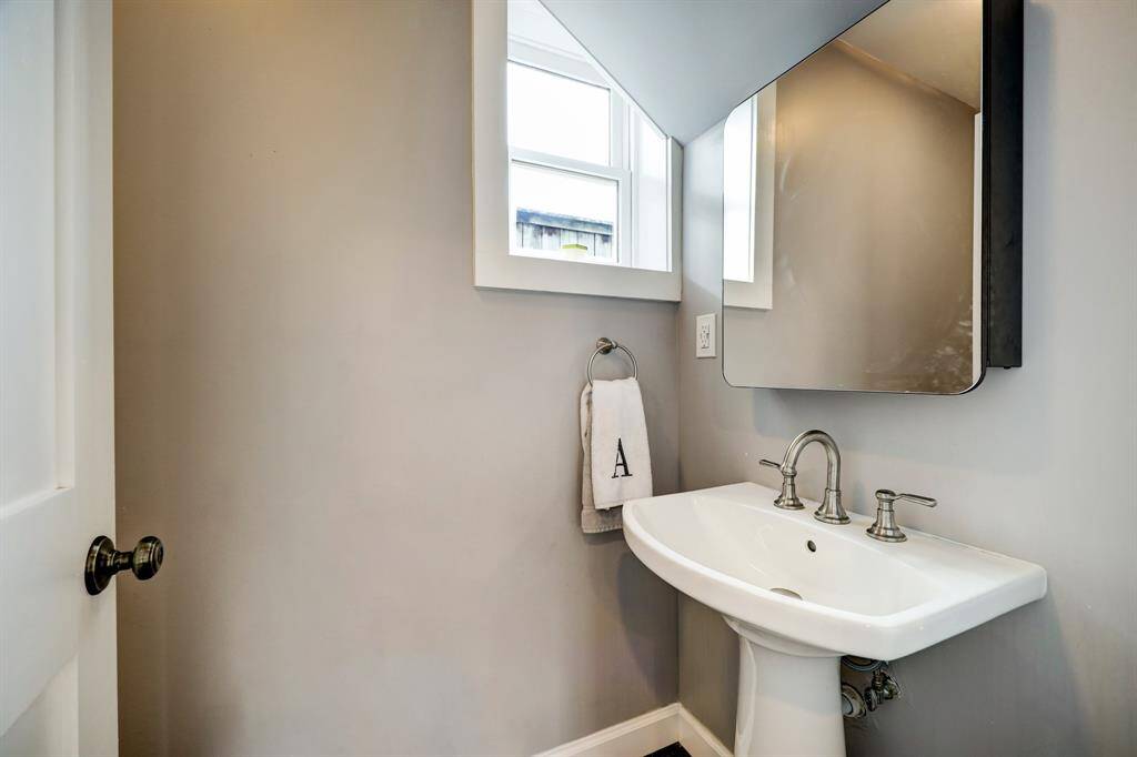 Half bathroom in the den area. *Photos are from a previous listing and may not reflect the property's current condition.