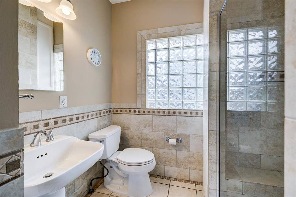 Three piece bathroom on the first floor. *Photos are from a previous listing and may not reflect the property's current condition.