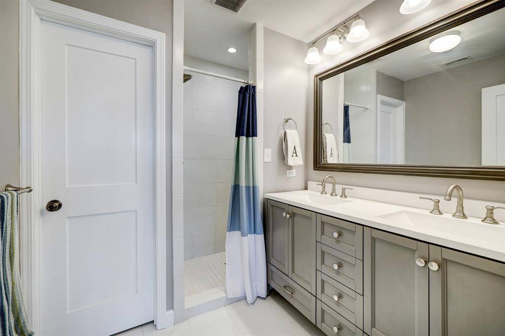 Primary bathroom with double sinks, walk-in shower and separate water closet. *Photos are from a previous listing and may not reflect the property's current condition.