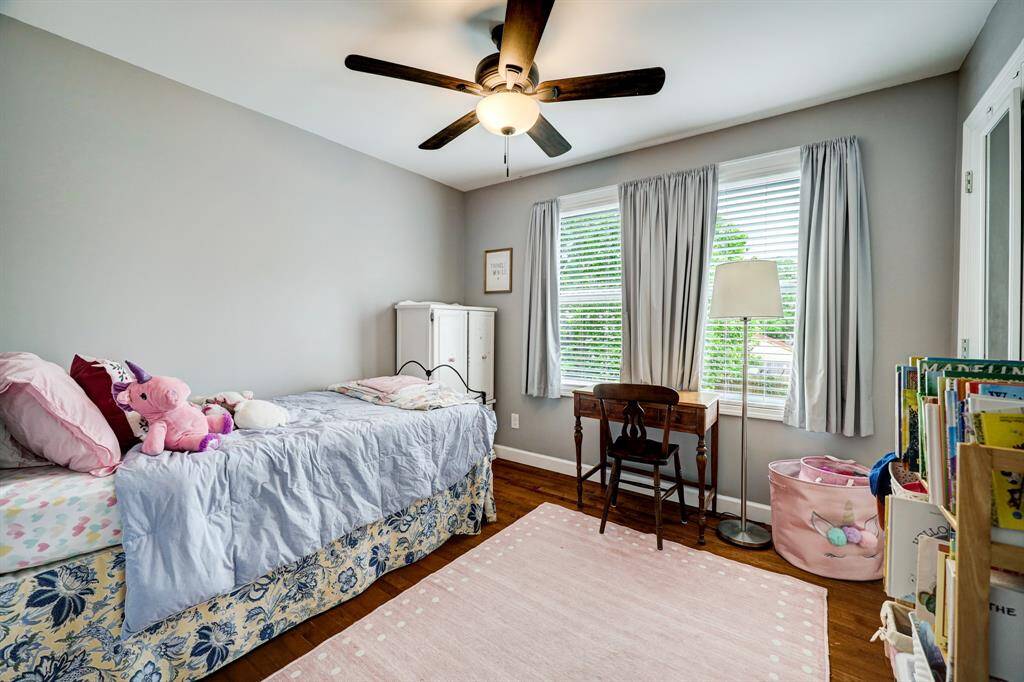 One of the secondary bedrooms upstairs has ample space and roomy closet. *Photos are from a previous listing and may not reflect the property's current condition.