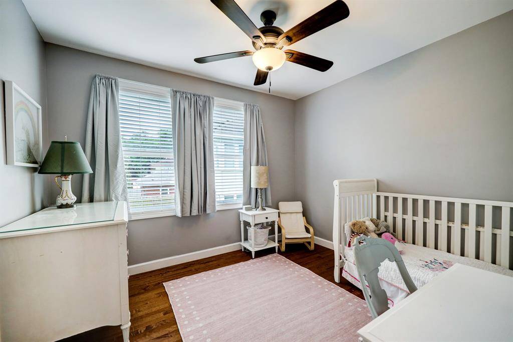 One of the secondary bedrooms upstairs has ample space and roomy closet. *Photos are from a previous listing and may not reflect the property's current condition.