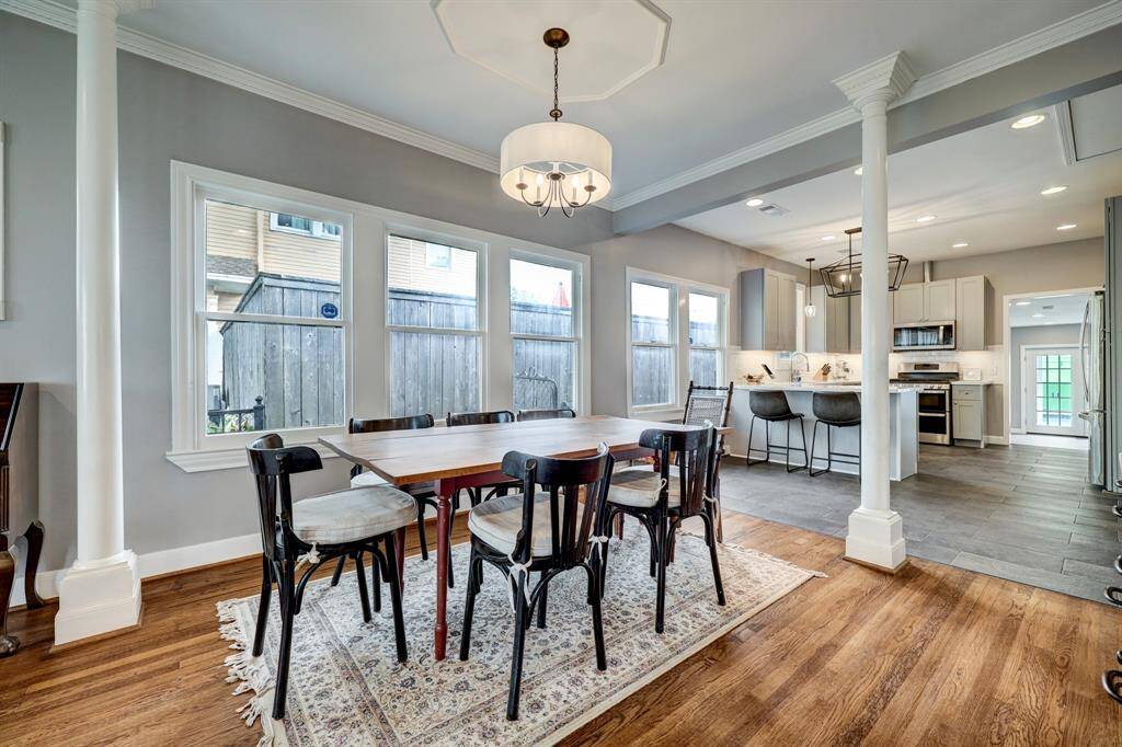 Dining area open to the living room and kitchen. *Photos are from a previous listing and may not reflect the property's current condition.