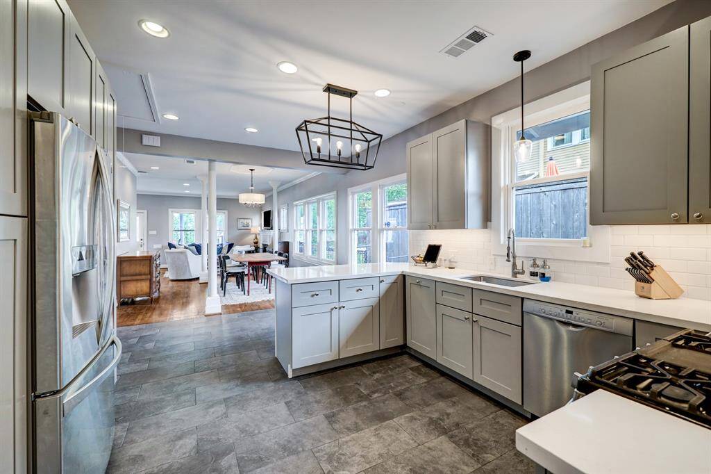 Another view of the open kitchen. Refrigerator included. *Photos are from a previous listing and may not reflect the property's current condition.