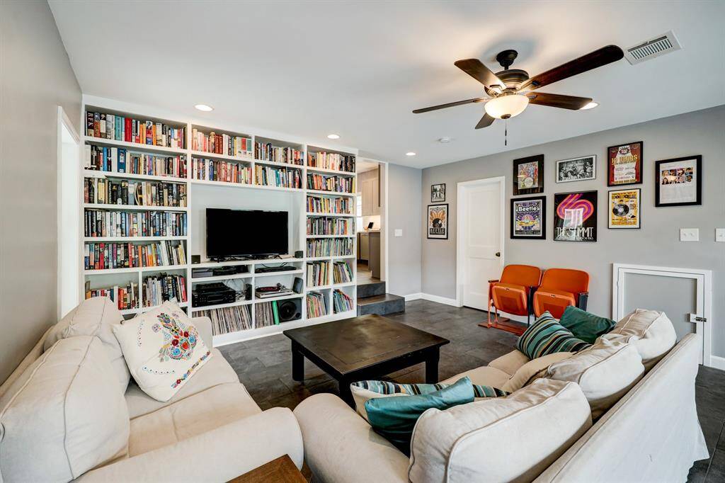 The den is located just off of the kitchen, includes built in bookshelves and lots of space to hang out. *Photos are from a previous listing and may not reflect the property's current condition.