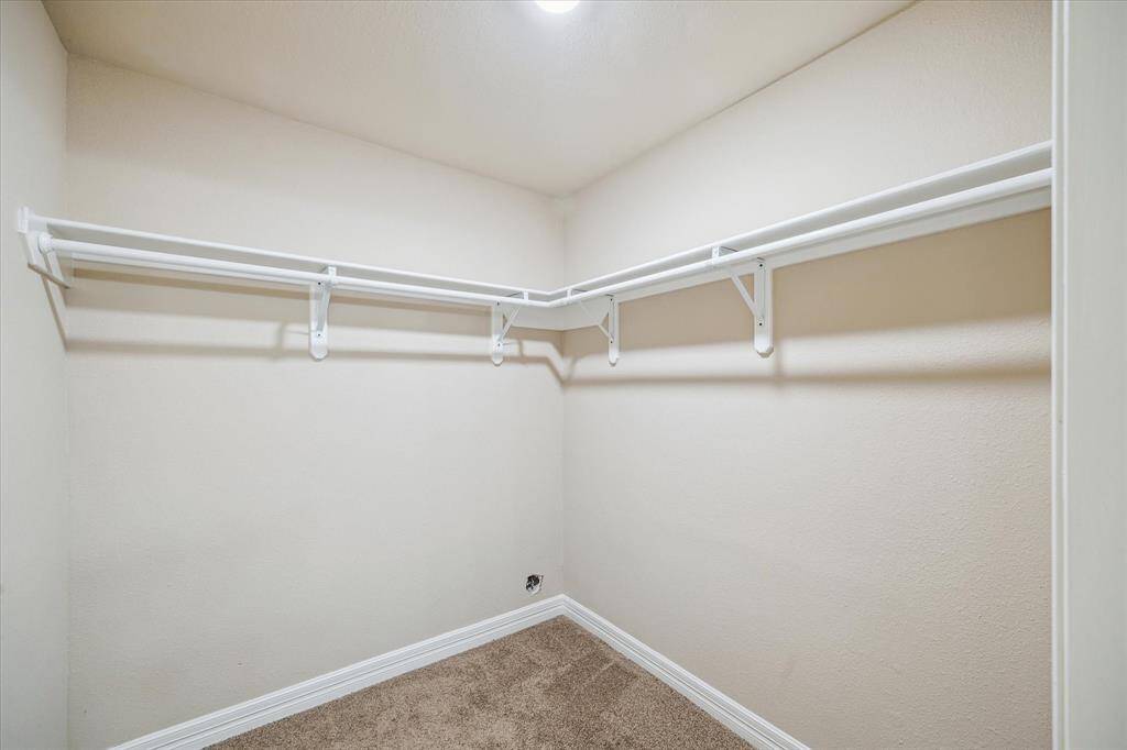 Spacious walk-in closet in the primary bedroom.