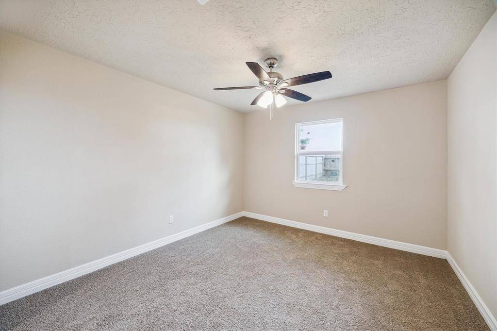 Bright and inviting second bedroom with brand new carpet - perfect for comfort and relaxation.